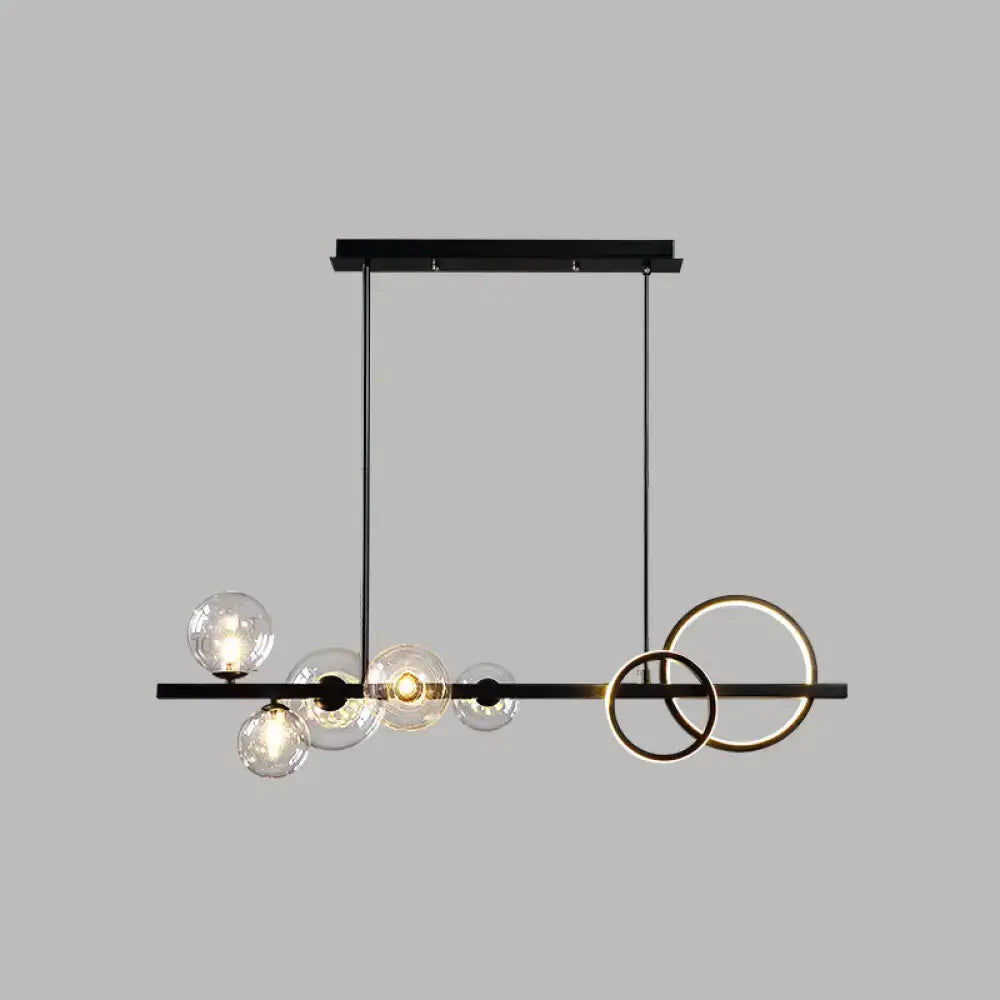 DecorBites™ contemporary 7-head island lamp with black metal, gold rings, and clear glass globe bulbs for dining room