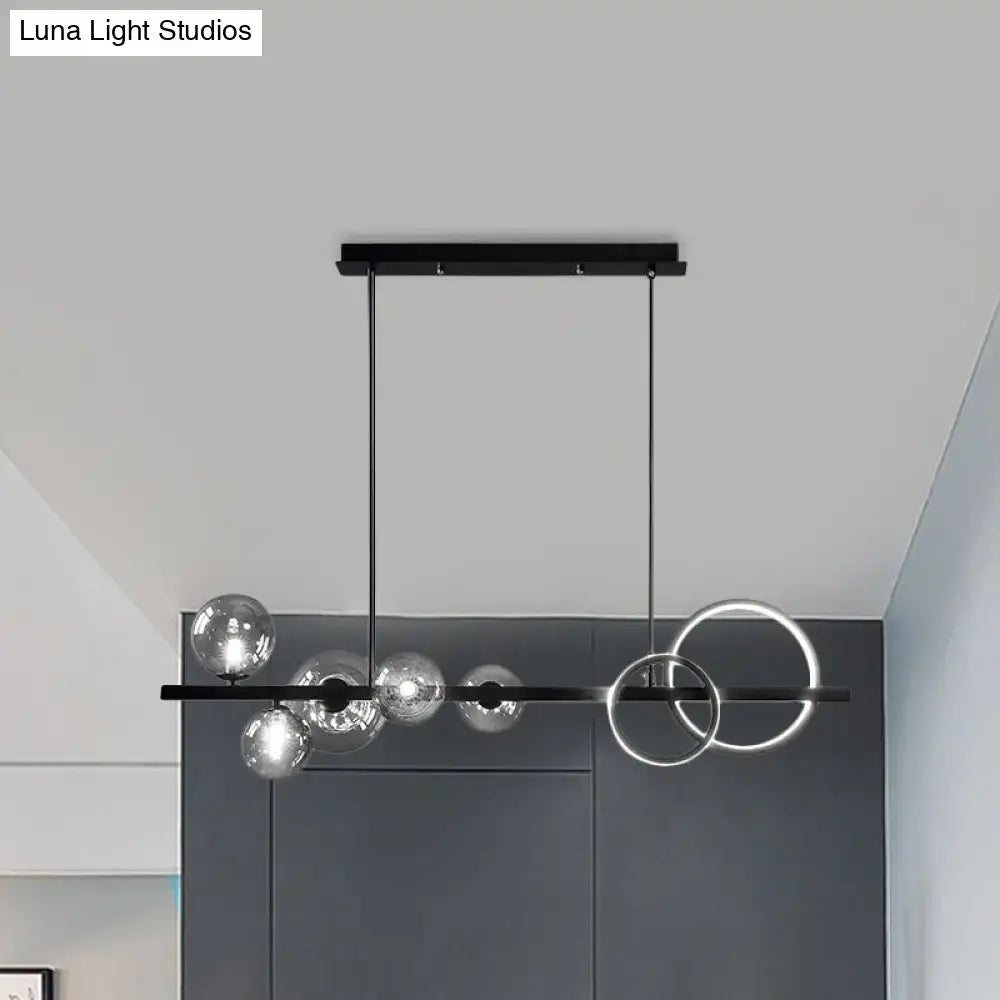 Modern black metal DecorBites™ island lamp with clear glass spheres smoke grey rings for dining room lighting