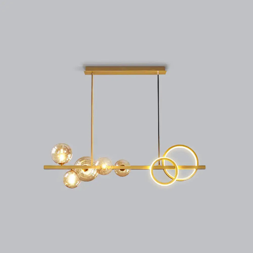 DecorBites contemporary 7-head gold-toned island lamp with milk white glass bulbs and smoke grey LED rings for dining room