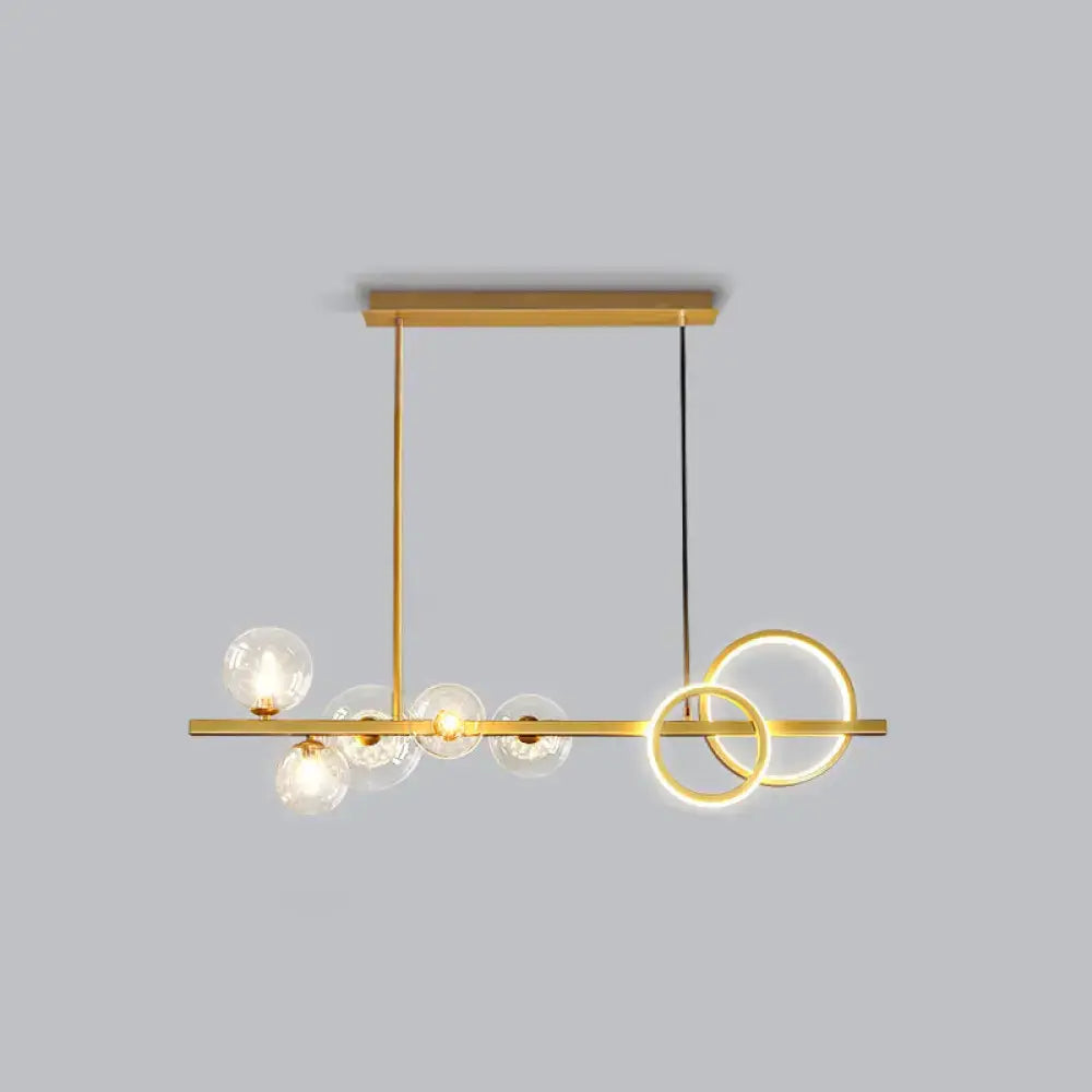 Decorbites™ contemporary gold-toned island lamp with clear glass globes and glowing rings for dining room lighting