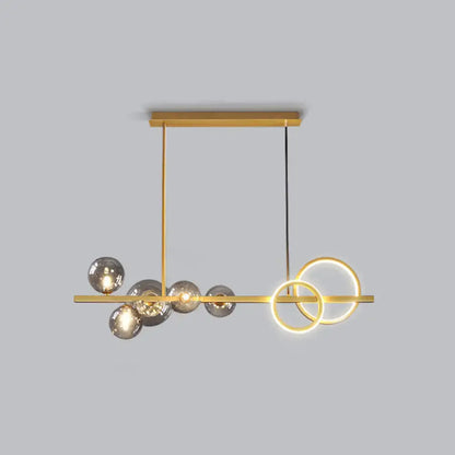 Decorbites contemporary glass island lamp with gold tones, milk white spheres, and smoke grey rings for dining room