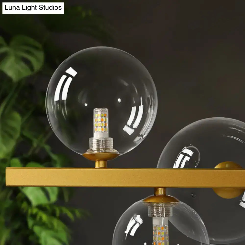 DecorBites contemporary 7-head gold-toned island lamp with clear glass globes and LED bulbs for dining room lighting