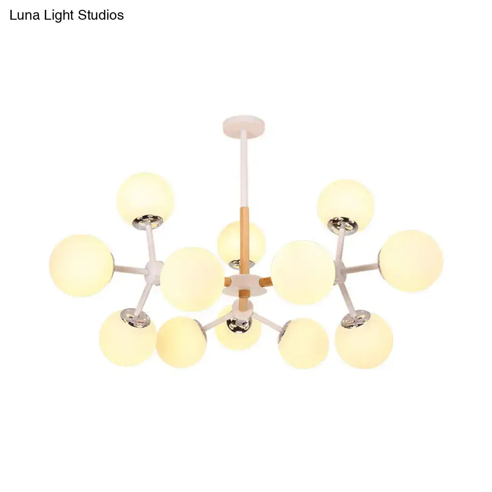 Modern DecorBites™ chandelier with white glass globe bulbs and wood-toned metal arms for dining room hanging light