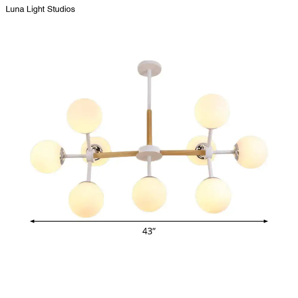 DecorBites contemporary globe chandelier with white glass frosted globes and wooden crossbar for dining room hanging light