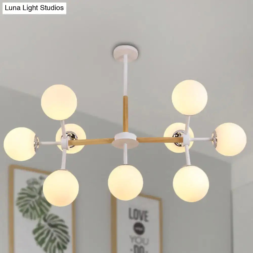 Decorbites contemporary globe chandelier with white glass globes and wooden rod as dining room hanging light kit