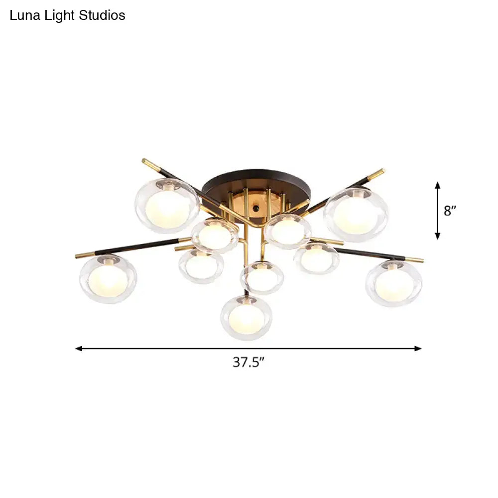 DecorBites™ semi-flush mount ceiling fixture with brass base black and gold arms and clear oval shade glass spheres
