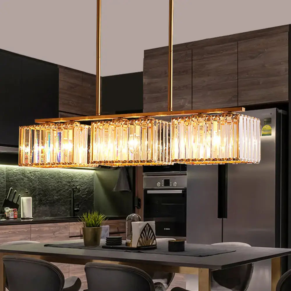 Gold-toned DecorBites™ contemporary pendant lighting with clear cuboid crystal shade and warm LED incandescent fluorescent lights