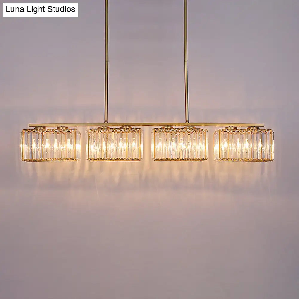Decorbites™ contemporary gold pendant lighting featuring a clear cuboid crystal shade with warm glowing led incandescent fluorescent lights