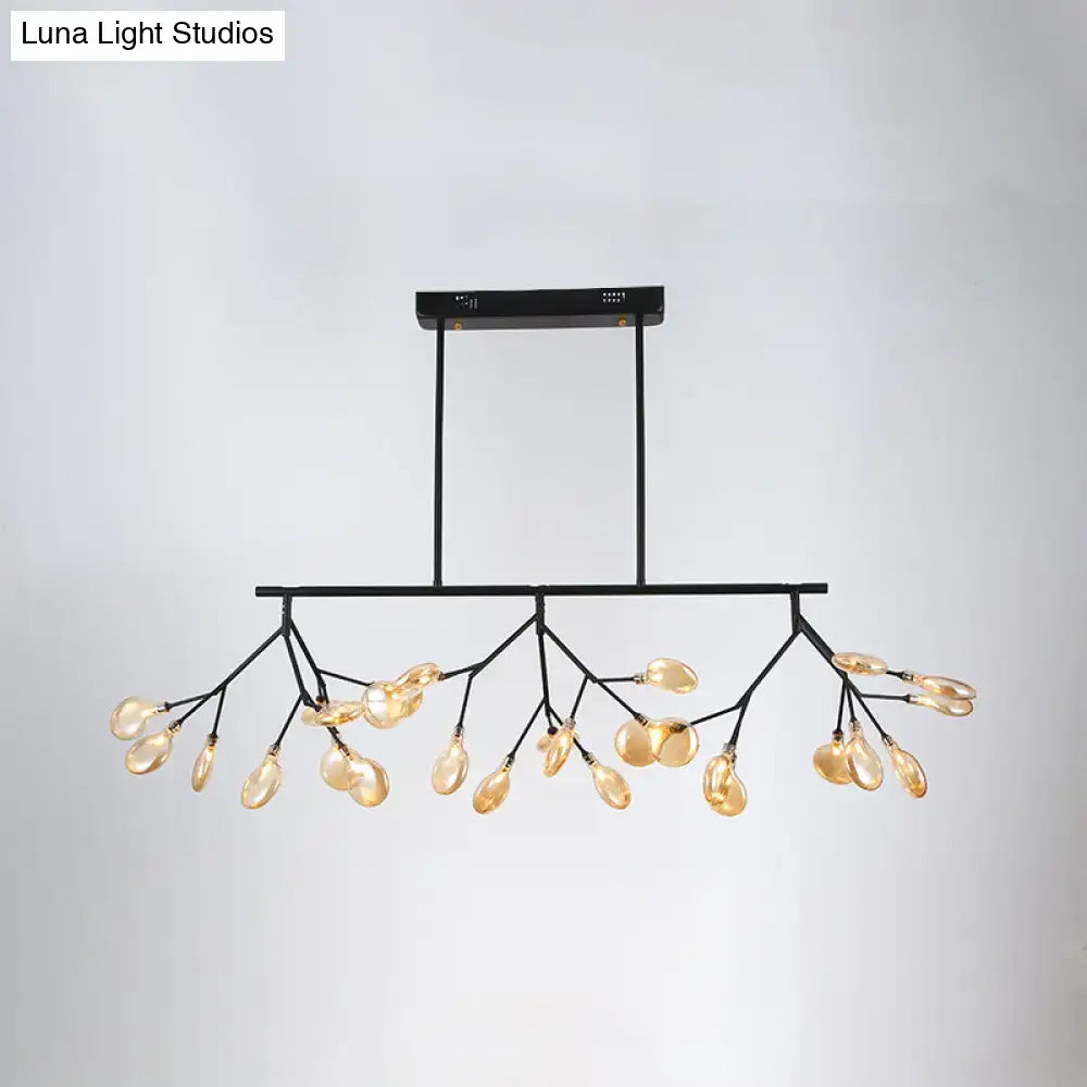 Black metal DecorBites heracleum island pendant with branching arms and amber glass teardrop island pendant light