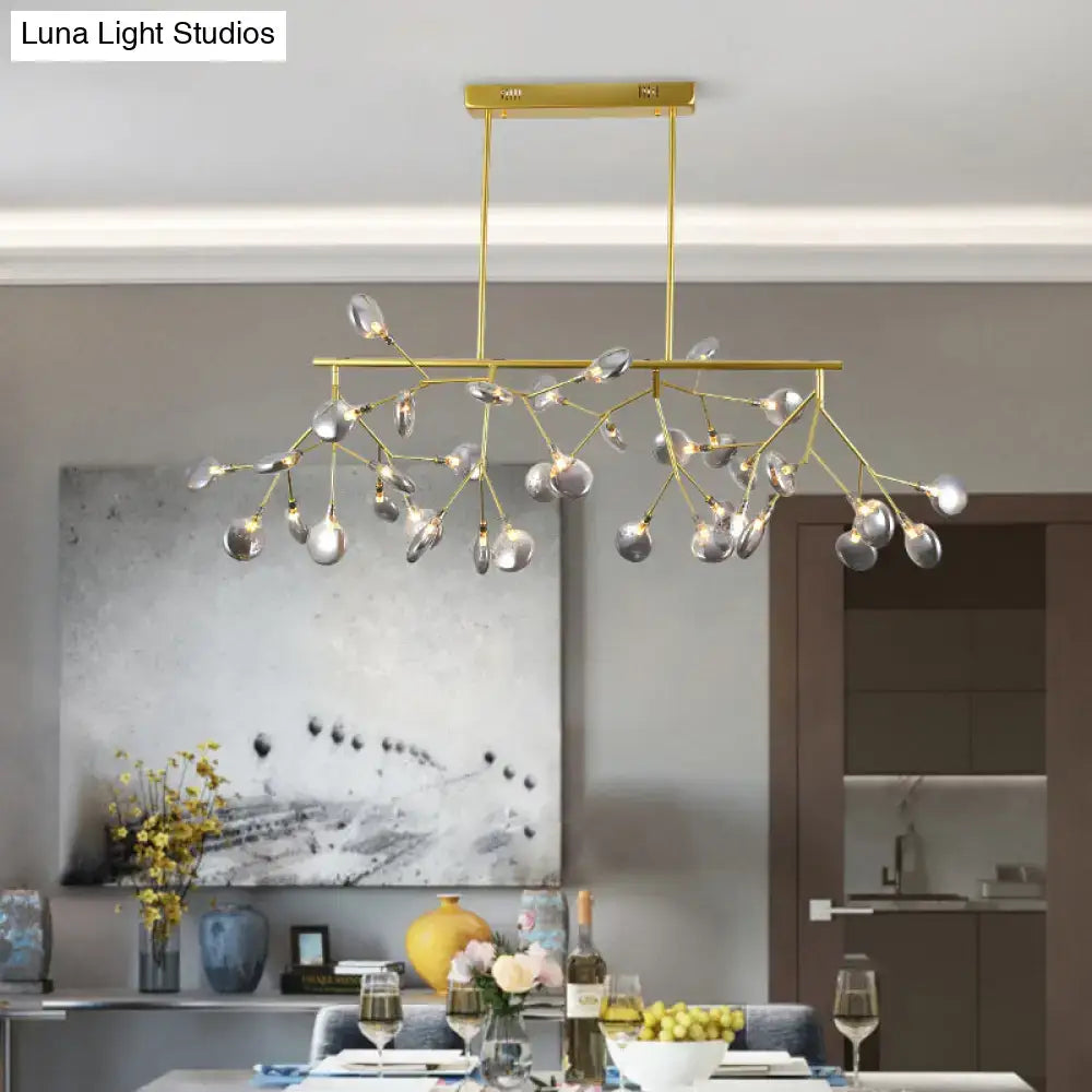 Gold-toned DecorBites heracleum island pendant light with branching arms and clear glass globe shades for modern dining rooms
