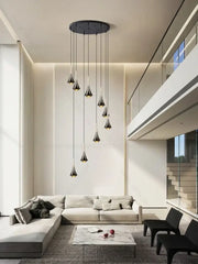 Modern black glass pendant chandelier with tapered shades hanging from circular mount decorbites contemporary horn