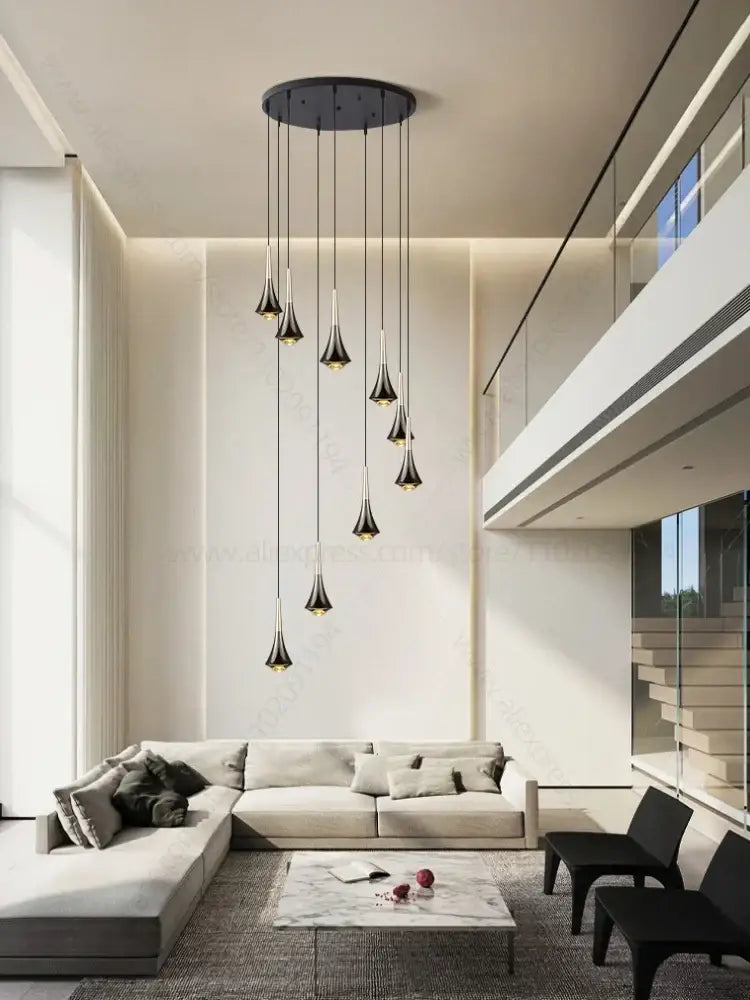 Modern black glass pendant chandelier with tapered shades hanging from circular mount decorbites contemporary horn