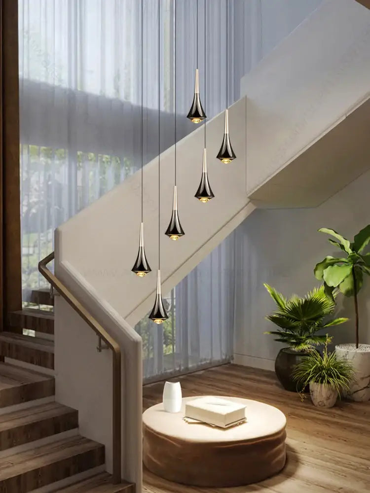 Modern black and gold decorbites contemporary horn chandelier with sleek tapered glass pendants for elegant living room lighting