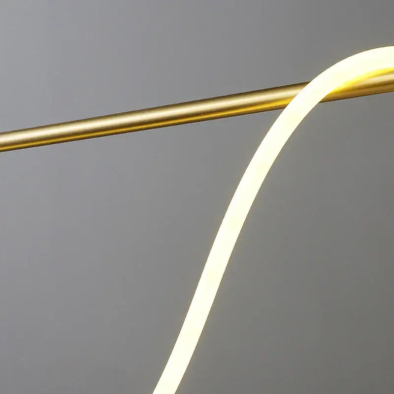 A decorbites™ contemporary led chandelier with a warm white long hose led strip on a polished brass rod for dining room lighting