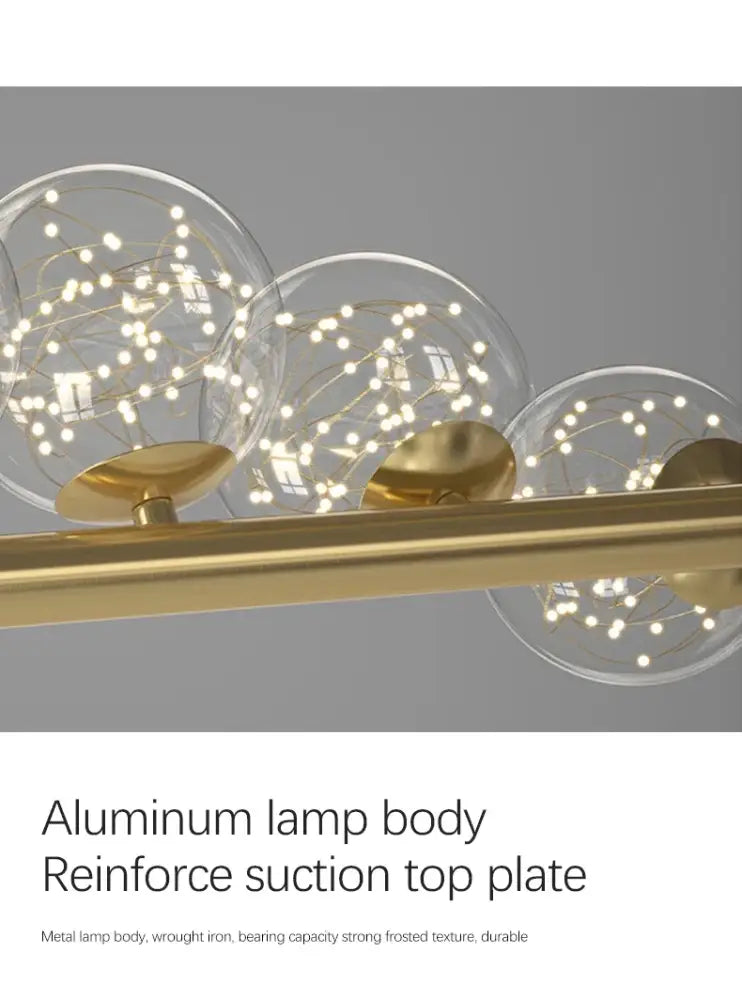 Modern brass-finished decorbites contemporary led glass ceiling chandelier with three clear glass spheres and string lights
