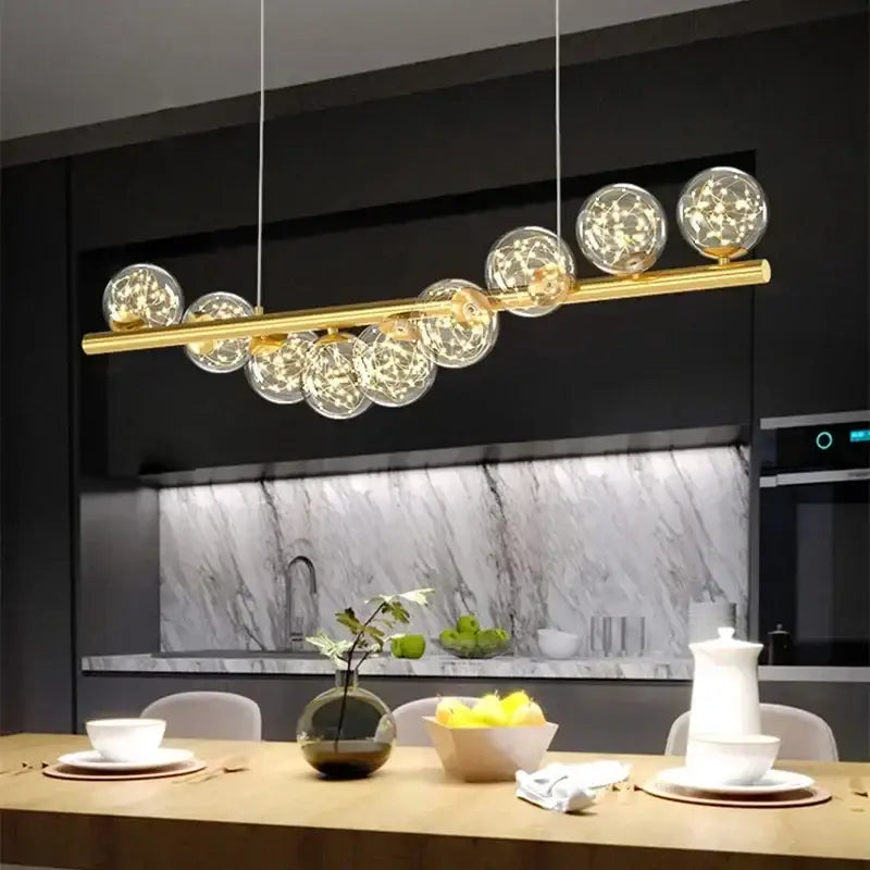 Gold-toned decorbites contemporary led glass ceiling chandelier with clear glass spheres and warm led lights for home lighting