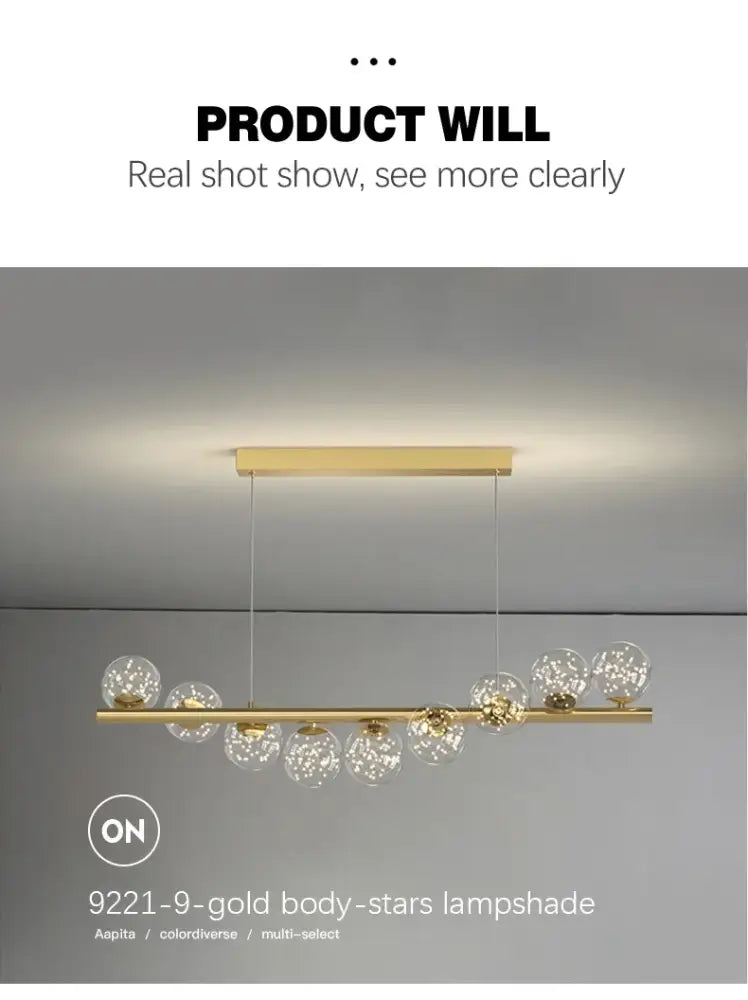 DecorBites™ contemporary LED glass ceiling chandelier with gold-toned pendant lamps and clear globe shades on a sleek bar