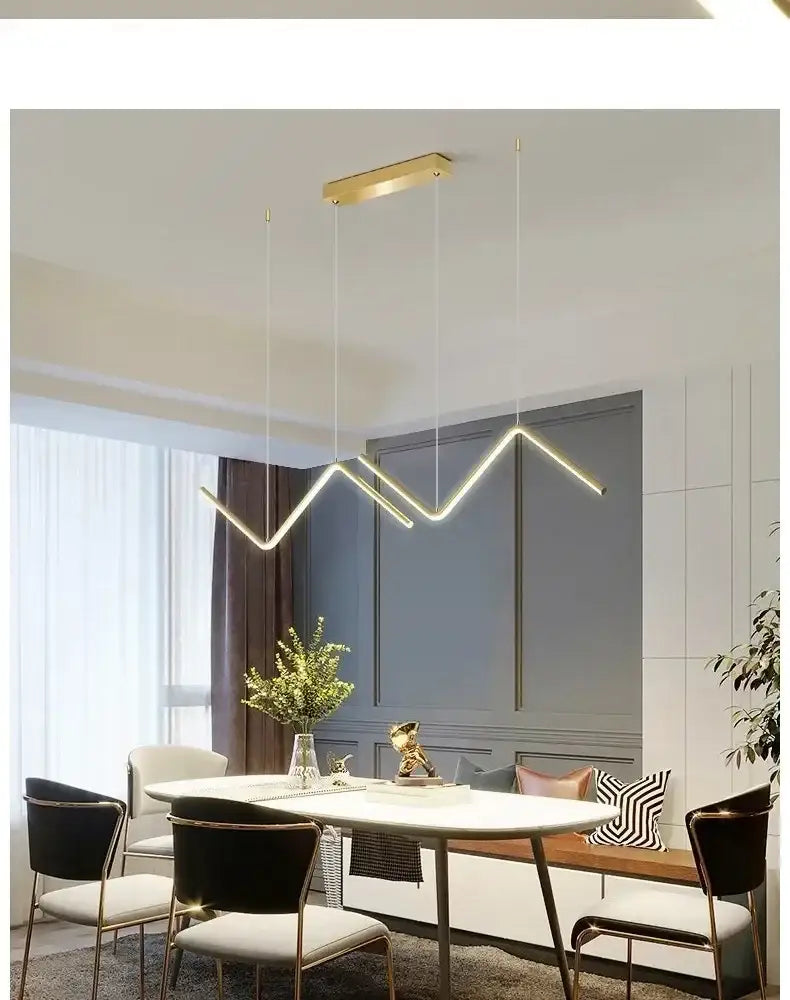 Decorbites™ contemporary gold-toned geometric led pendant lights with zigzag design hanging above dining table