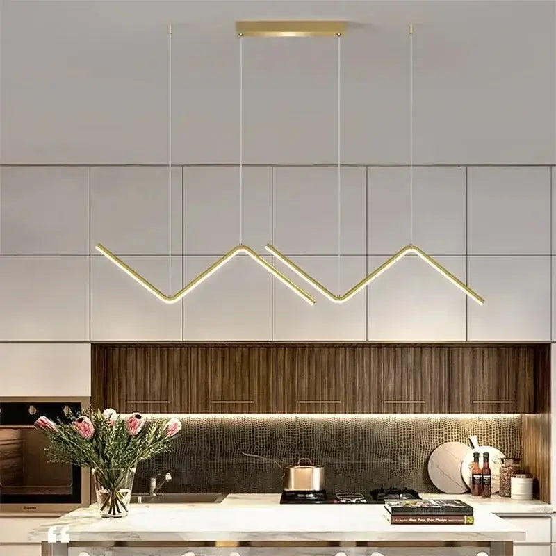 DecorBites™ contemporary gold-toned led pendant lights with sleek zigzag design suspended above kitchen counter
