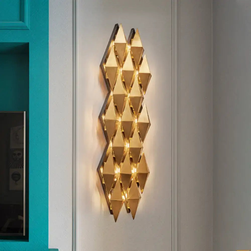 Modern gold diamond wall lamp with gold-toned geometric faceted light fixture for bedroom illumination