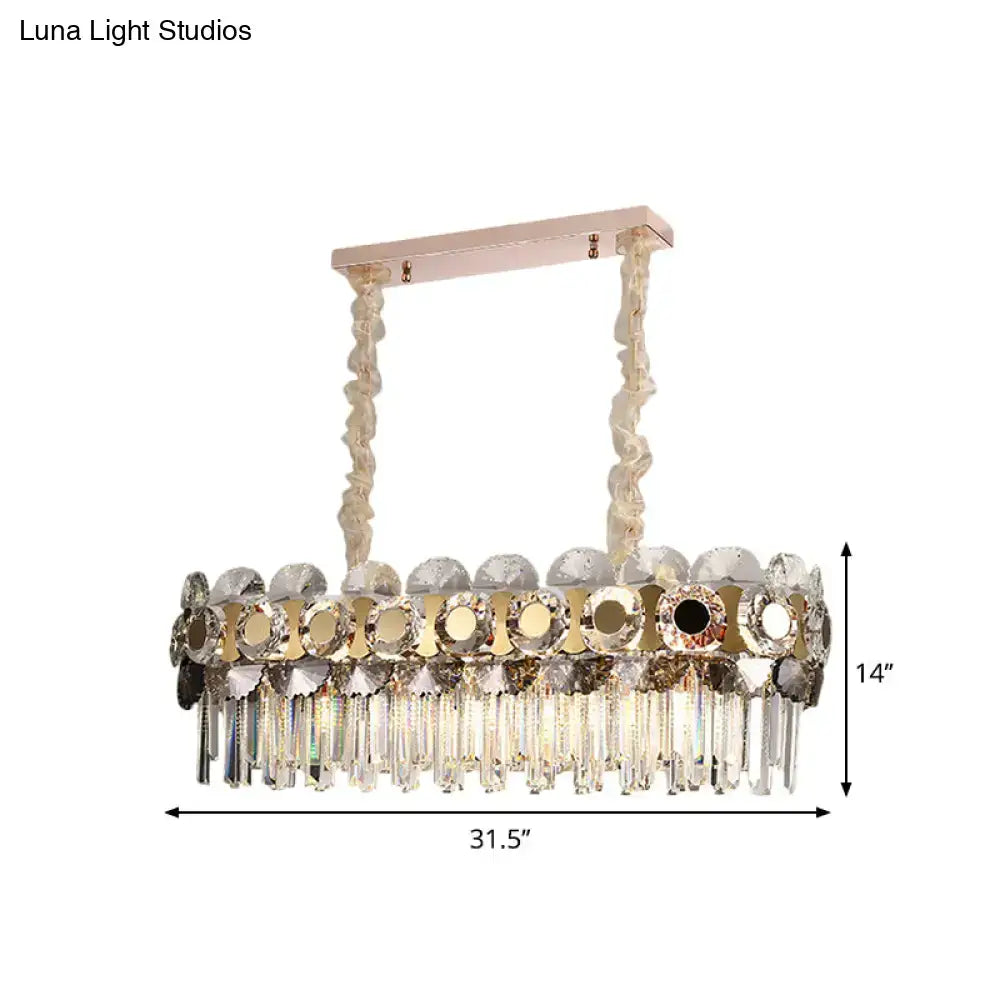 Luxurious rose gold metal facing island chandelier with mirrored discs and clear crystal prisms featuring 11 bulbs