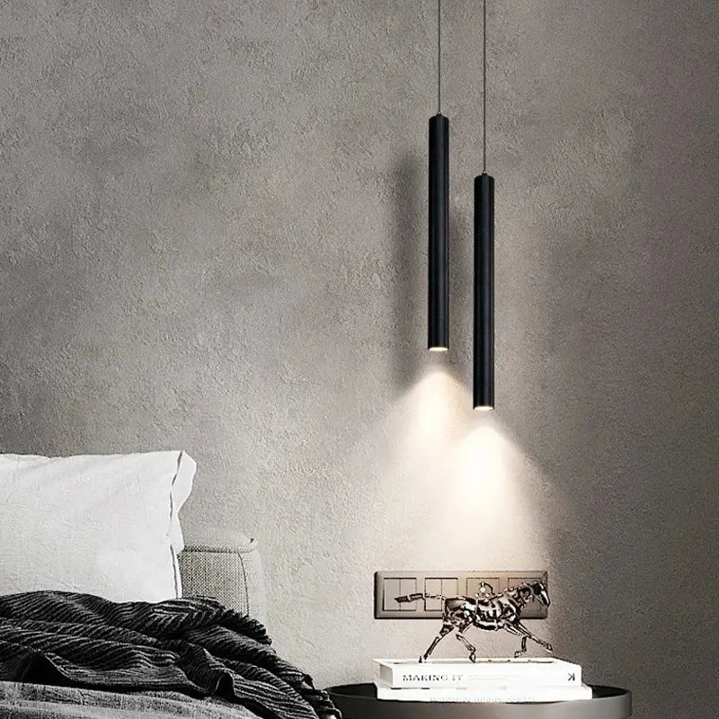 Two sleek black DecorBites™ contemporary nordic led pendant lights cast a warm glow for dining room use