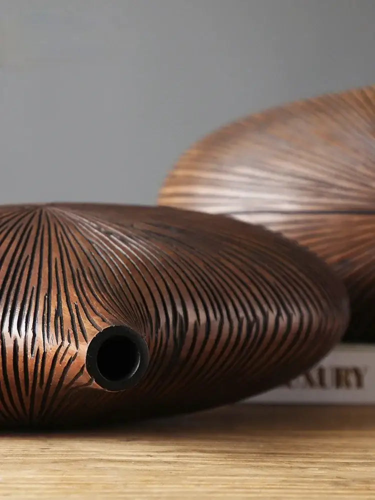 DecorBites™ contemporary resin vase in dark brown with radial grooves and central circular opening for flower arrangements