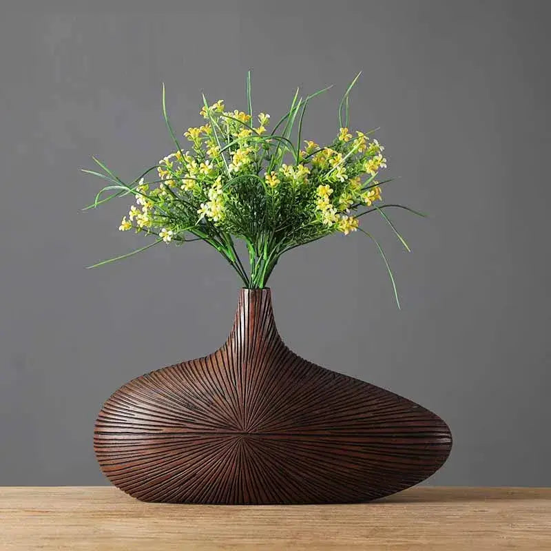 Decorbites™ contemporary resin vase in dark brown with sleek teardrop shape and radiating grooves for flower arrangements