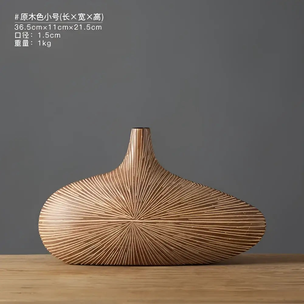 A sleek light brown contemporary resin vase with smooth elongated body and linear grooves for flower arrangements