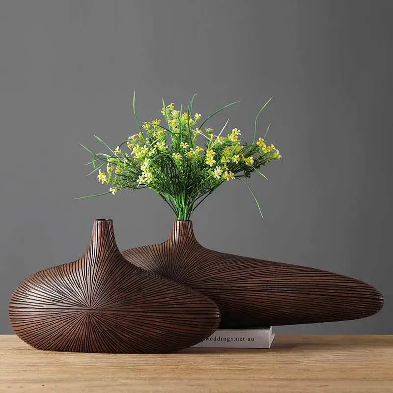 Two dark brown intricately ribbed ceramic vases with modern organic design decorbites™ contemporary resin vase