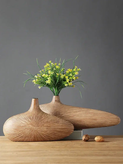 Two sleek light-brown wooden vases with radial grooves showcasing decorbites contemporary resin vase design