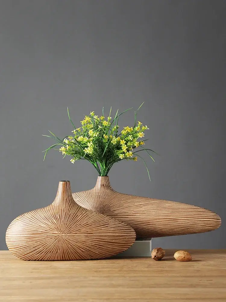 Two sleek light-brown wooden vases with radial grooves showcasing decorbites contemporary resin vase design
