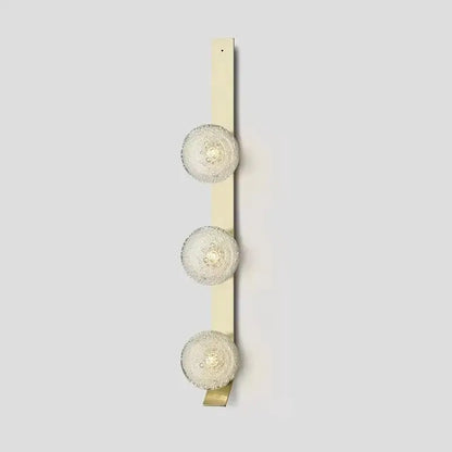 DecorBites™ contemporary wall light with three cream-colored frosted glass spherical bulbs wall-mounted fixture