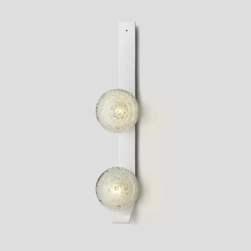 White DecorBites™ contemporary wall light with two frosted bubble-textured glass globe shades mounted on wall
