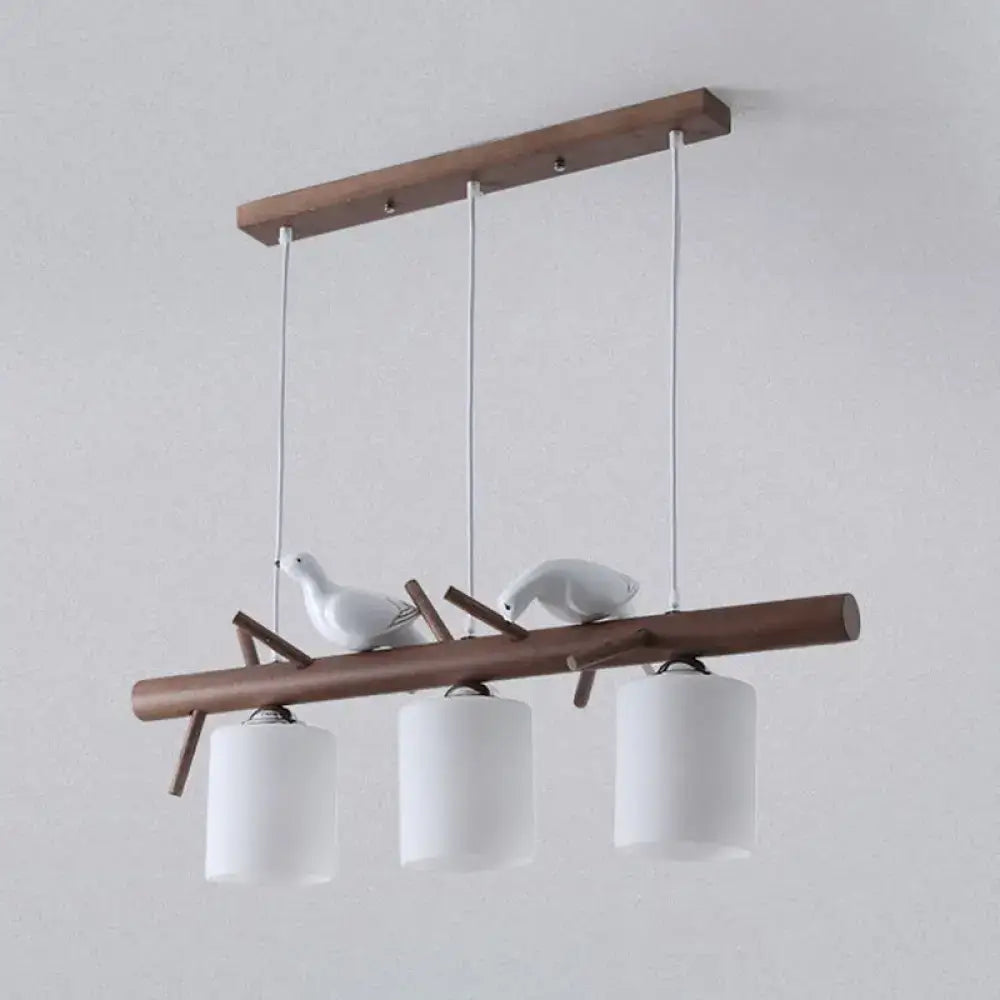 DecorBites contemporary wood island pendant with nutcracker design features cylindrical glass shades and e26 e27 bulbs