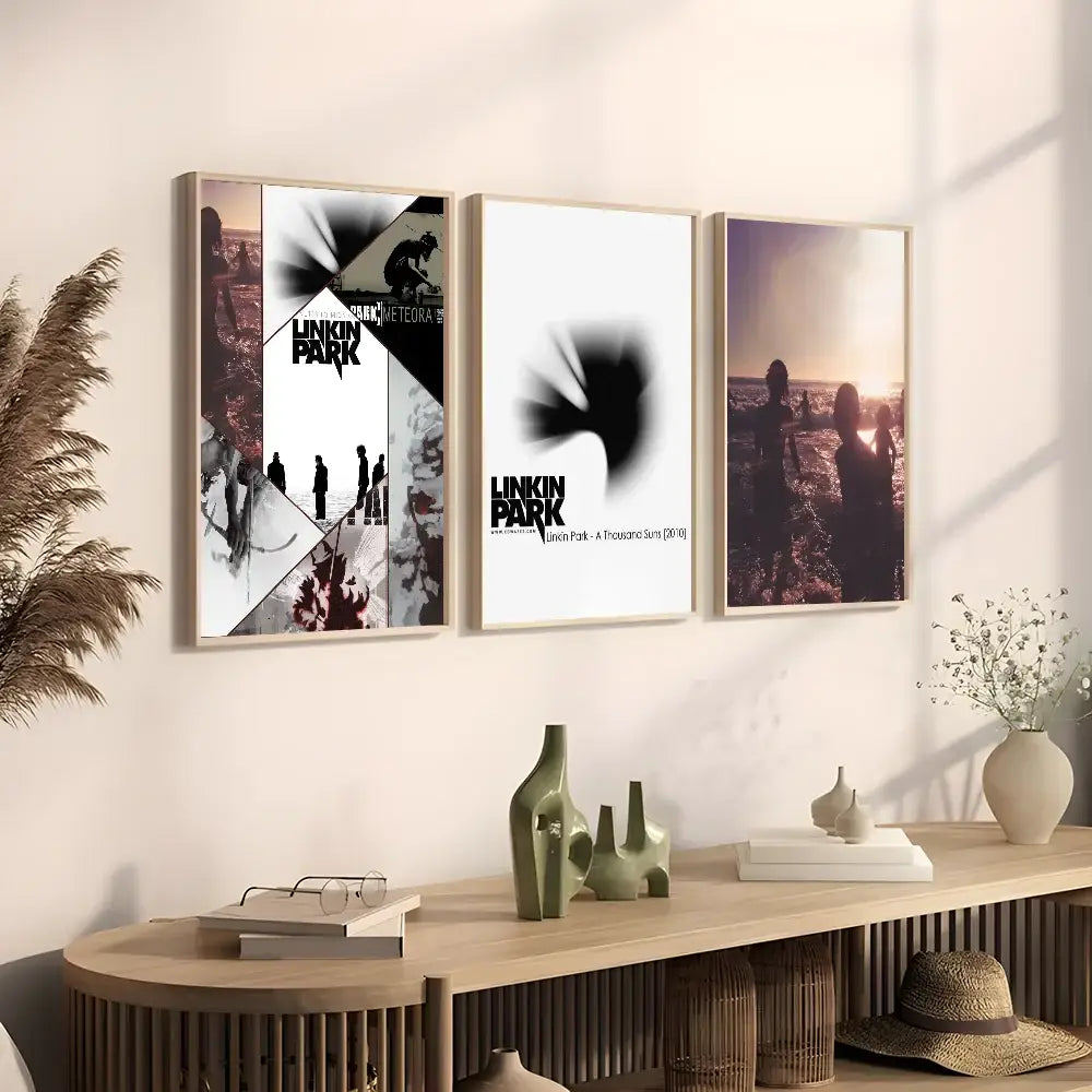 Three framed linkin park posters with minimalist wooden frames featuring black and sepia tones as poster wall art