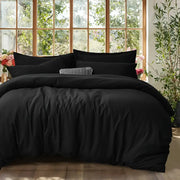 DecorBites™ black satin-like cotton duvet cover set with matching pillows and a textured accent pillow in center