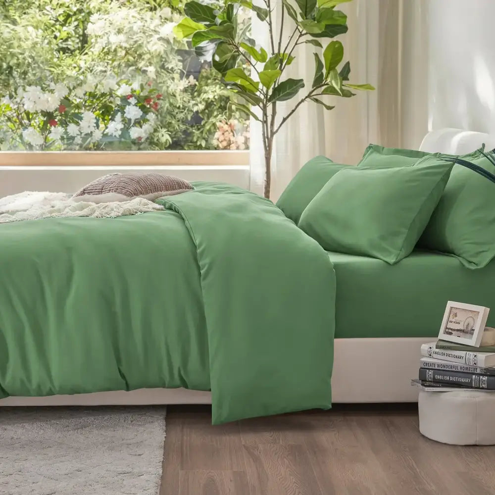 Green satin-like cotton duvet cover set with matching pillows from decorbites cooling summer collection