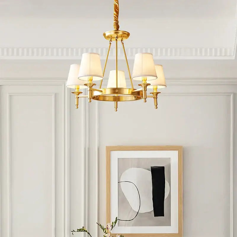 Gold-toned brass decorbites copper american chandelier with five cream fabric shades for dining room lighting