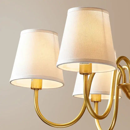 Gold-toned decorbites copper american chandelier with three off-white fabric lampshades for living room lighting