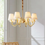 Gold-toned decorbites copper american chandelier with six cream fabric shades and twisted rope chain for living room