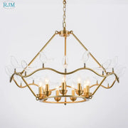 Gold-toned decorbites copper bird chandelier with clear glass figurines and multiple lit bulbs for dining room lighting