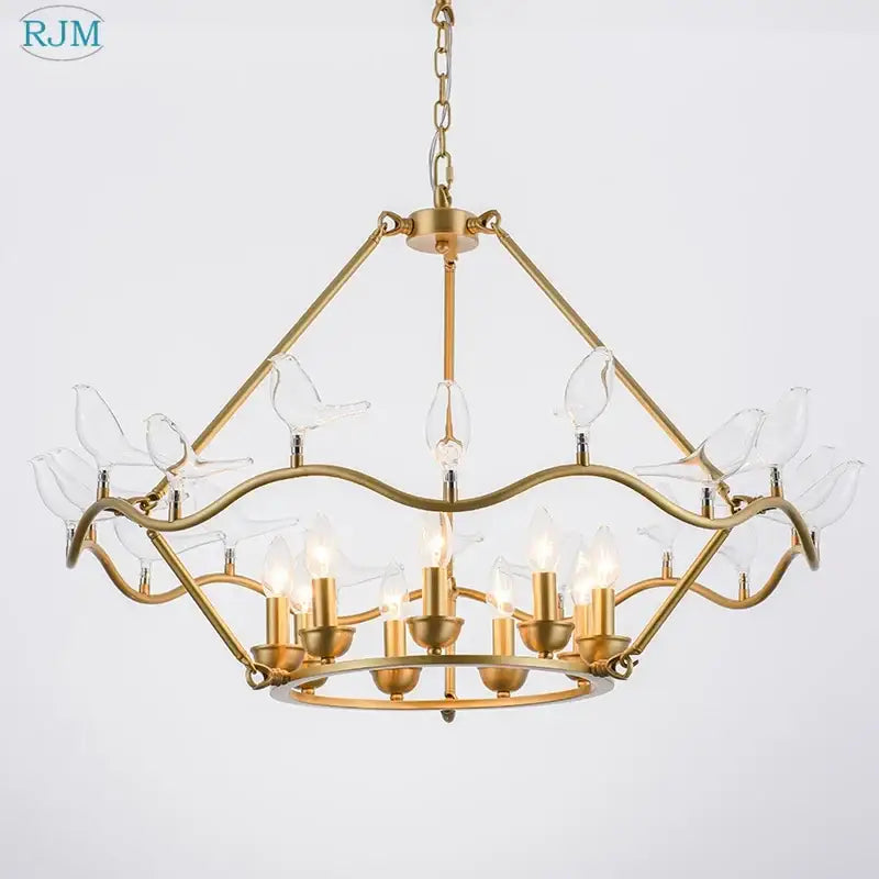 Gold-toned decorbites copper bird chandelier with clear glass figurines and multiple lit bulbs for dining room lighting