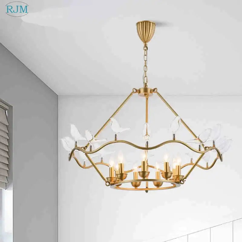 Gold-toned decorbites copper bird chandelier with clear glass bird ornaments and geometric multi-tiered design for dining room