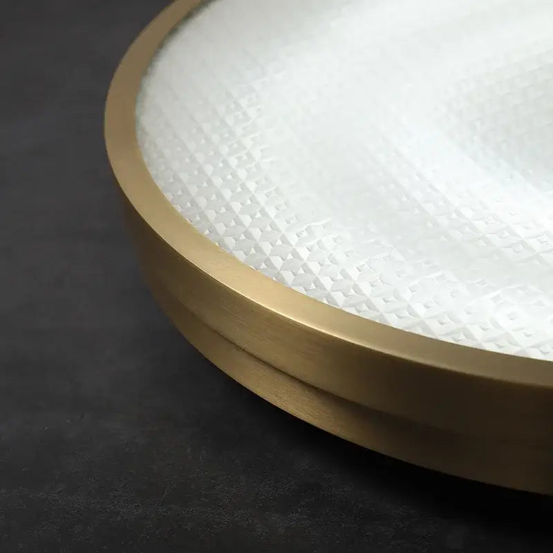 Modern brushed brass copper ceiling lamp with frosted glass diffuser and subtle geometric pattern for bedroom lighting
