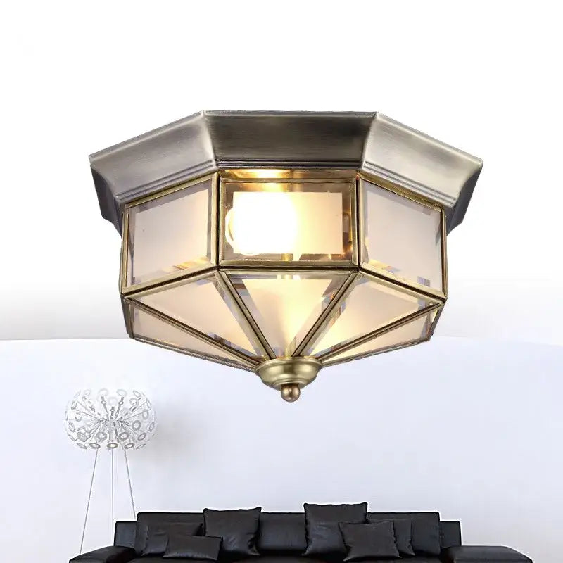 Retro brass octagonal copper ceiling lamp with frosted glass panels emitting a warm glow for living room use