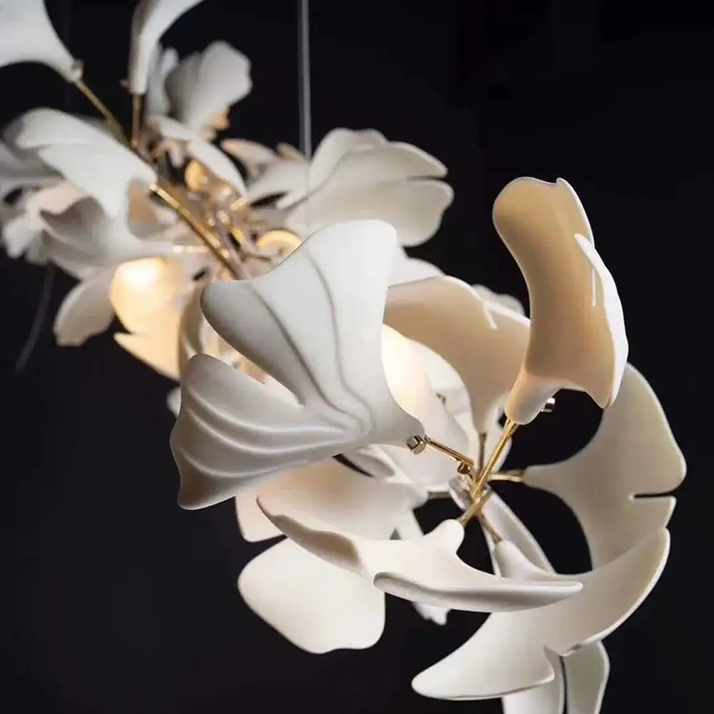 White ceramic ginkgo leaf chandelier lantern with gold-toned metal stems for luxury dining room lighting