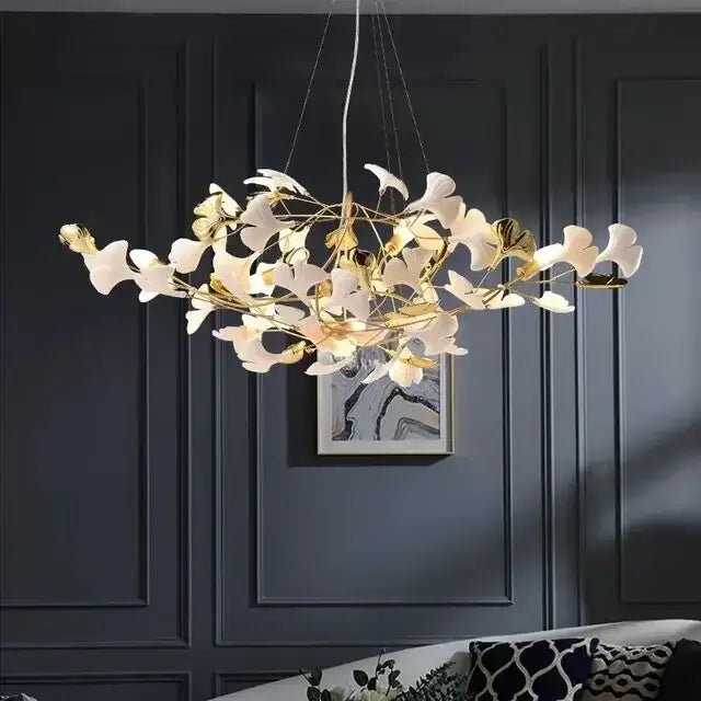 White ginkgo leaf chandelier lantern with delicate gold and white shades designed for luxury dining room lighting