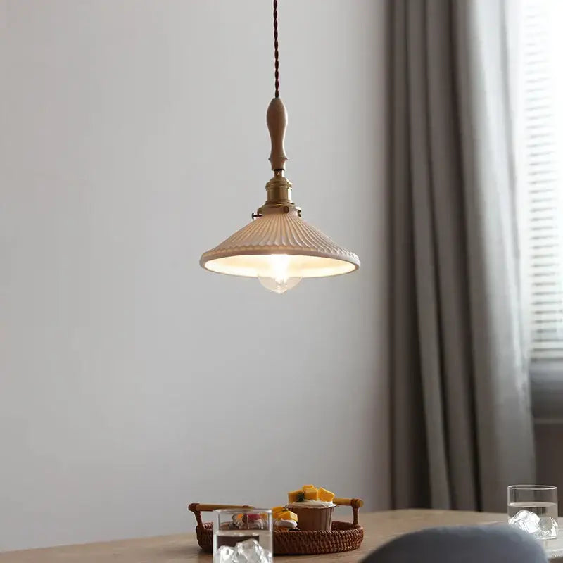 Vintage cream ceramic led pendant lamp with warm-toned ribbed shade brass fixture and wooden pull chain pendant lamp