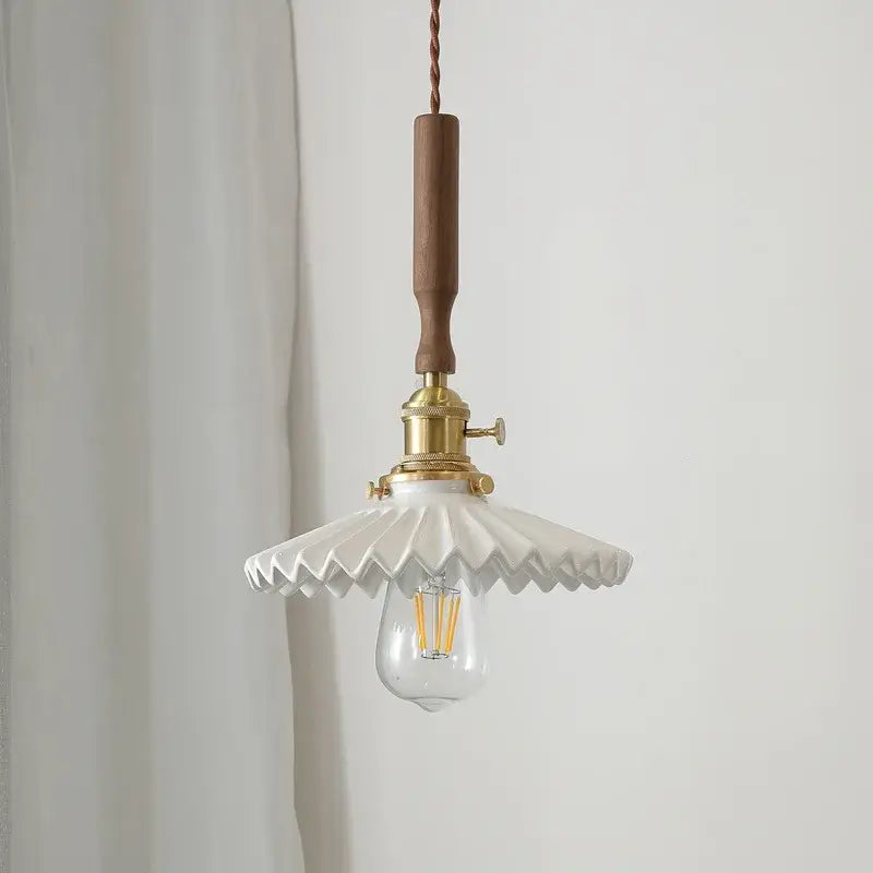 Vintage brass and ceramic led pendant light with white scalloped ceramic led shade and wooden handle suspension